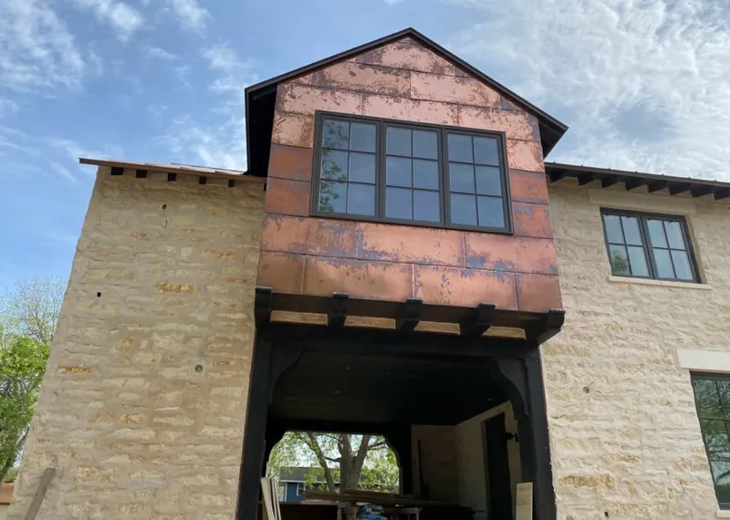 Copper metal panel facade on a stone building for Metal Roof Coating in St. Augustine Beach