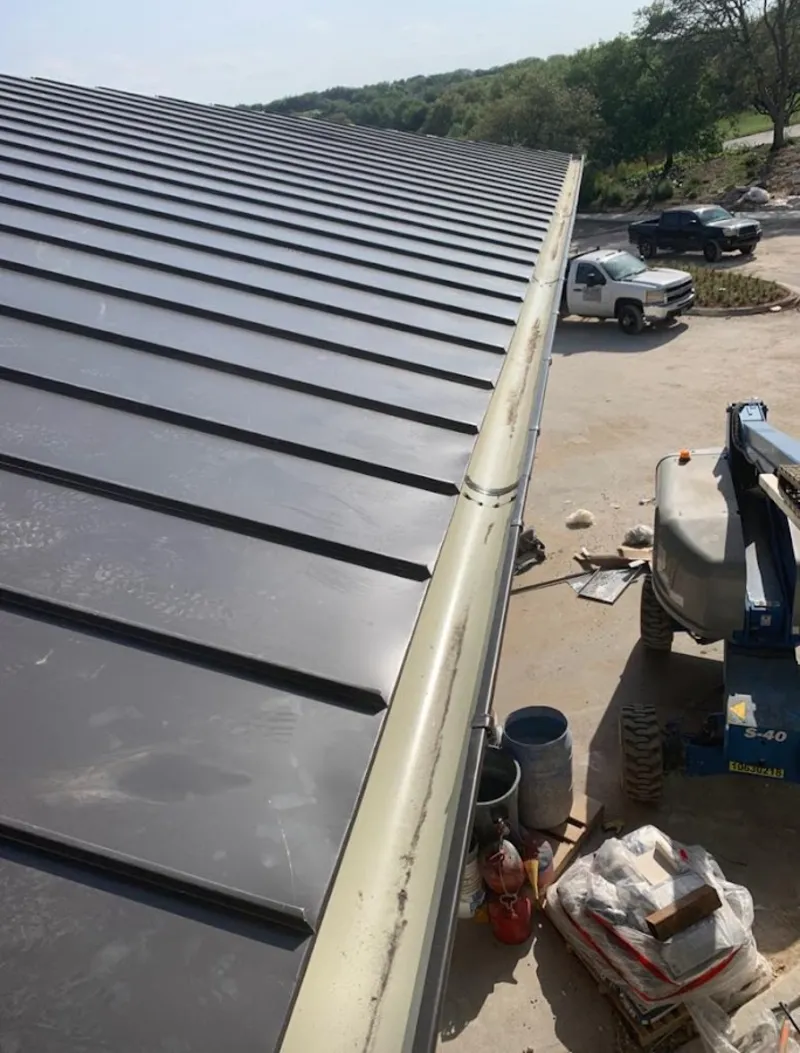 Standing seam panel and gutter detail on a metal roofing jobsite in St. Augustine Beach